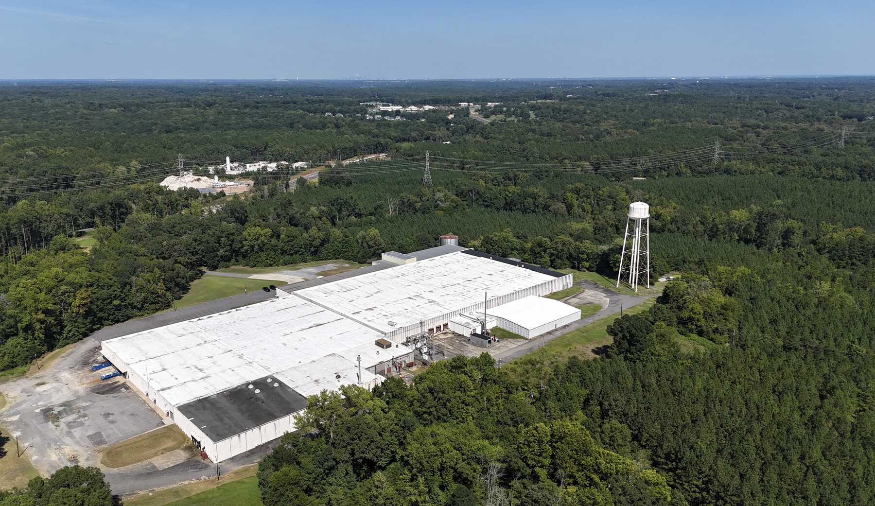Aerial view of a large industrial facility in Clover, South Carolina, showing the building, site, and surrounding area.
