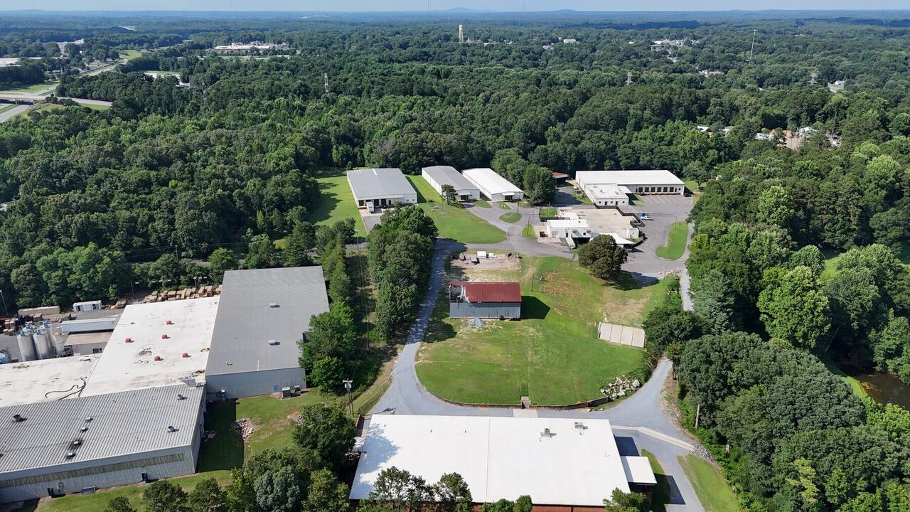 Aerial comparison view of buildings and site layout at the Interchange Drive commercial campus
