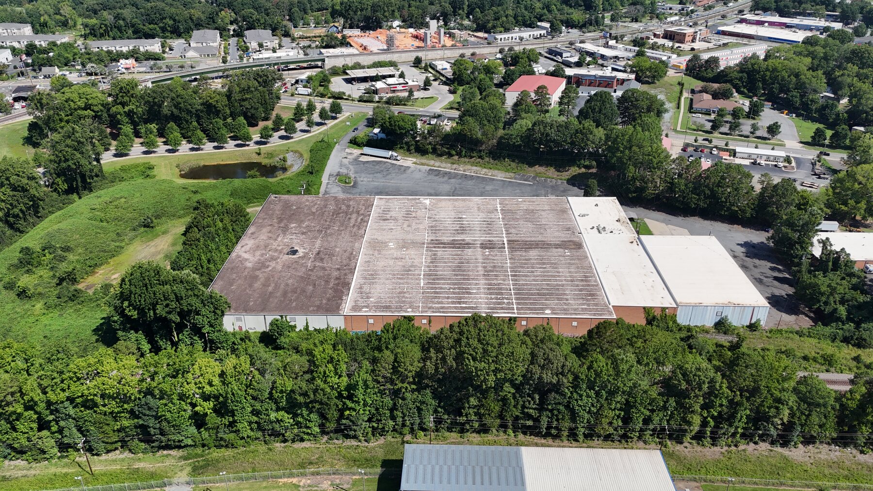 Aerial view of an industrial property near Old Concord Road showing rail access and surrounding development.