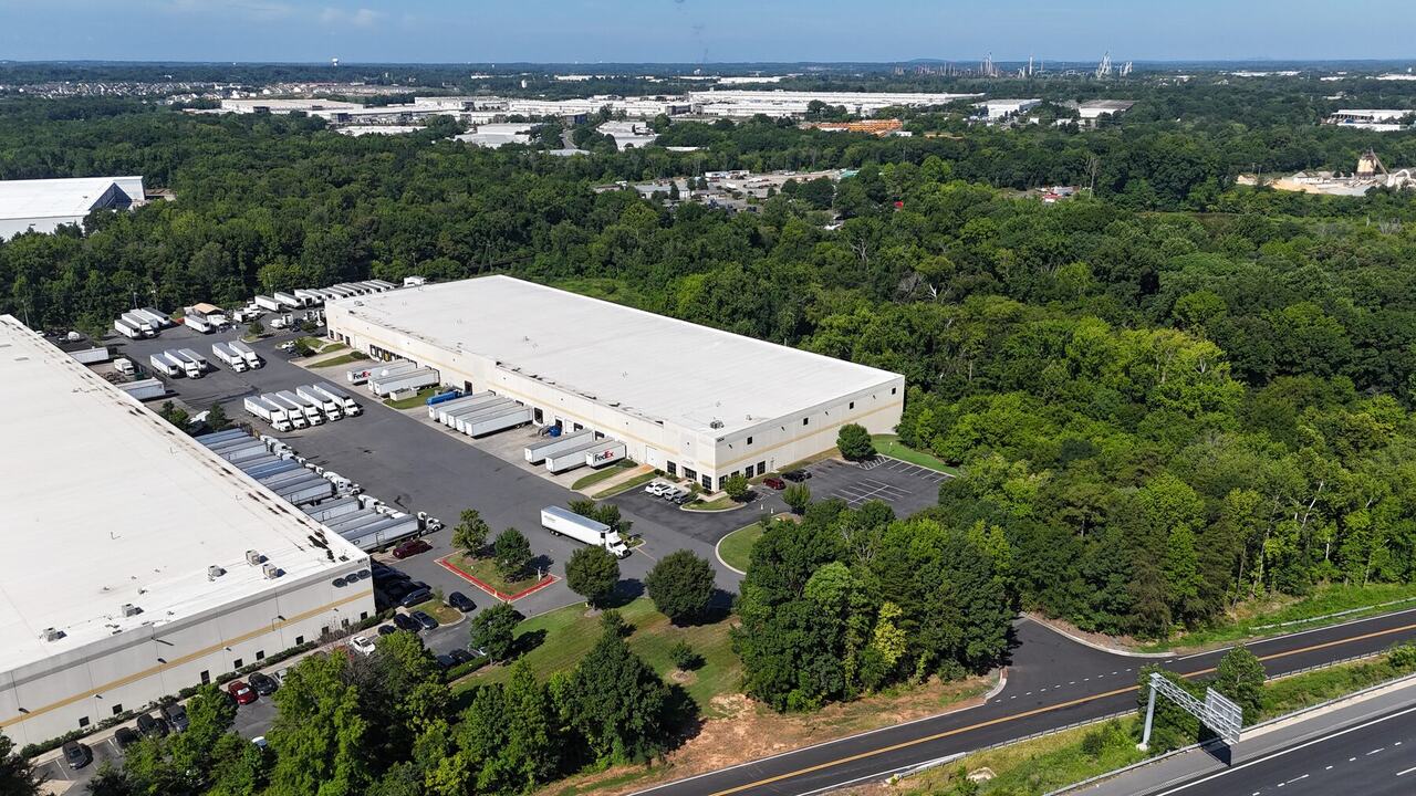 Aerial view showing a Rodney Street warehouse, nearby roads, and Charlotte location context